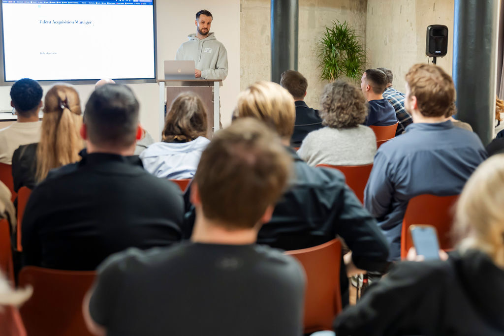 Jamie leading a hands-on AI workshop for a room of recruiters